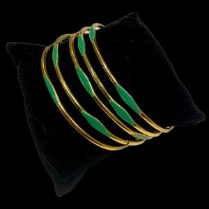 Vibrant vintage gold and with green flair bangle set,  7.75 inch circumference